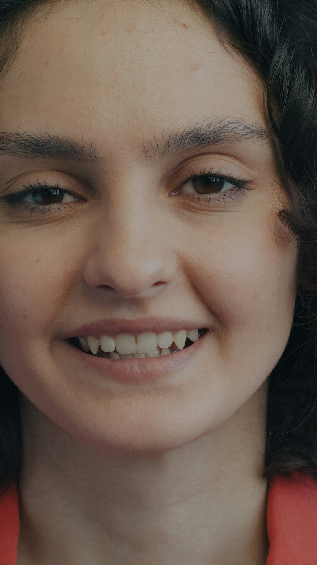Portrait of a smiling woman with dark hair