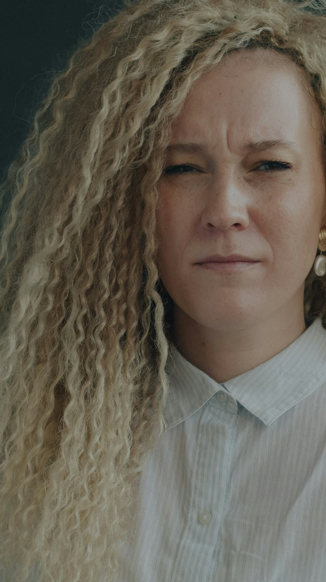 Portrait of a blonde woman with a calm expression
